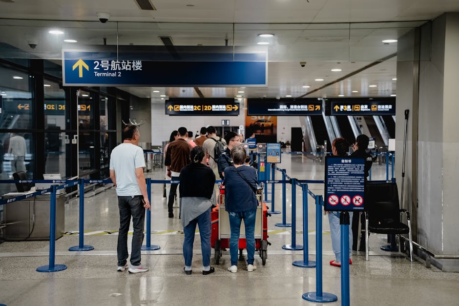 Passengers queue at Terminal 2 in Shanghai Airport, China.
